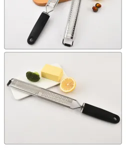 Stainless steel cheese grater with comfortable black handle for lemon zesting and kitchen prep.