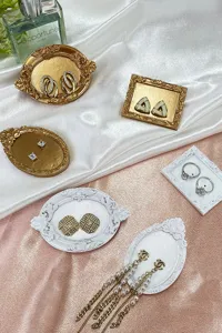 European style miniature resin display trays for earrings and jewelry photography props.