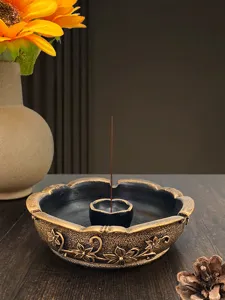 Vintage incense burner detail, classical floral relief design, resin censer for home office decor.