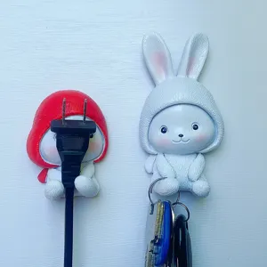 Cute cartoon rabbit wall hook punch-free plug and key organizer for home decor use.