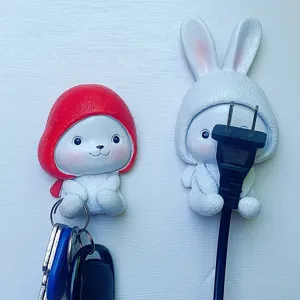 Cute cartoon rabbit adhesive wall hook, punch-free key holder and plug storage hook for home.