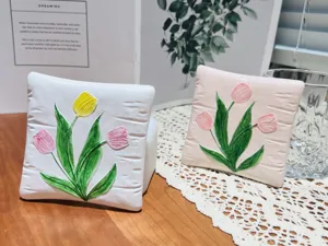 Close-up detail view of square resin tulip jewelry dish and coaster featuring 3D relief flowers.