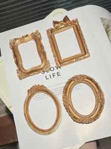 Vintage gold miniature photo frames, Victorian baroque style props for jewelry and nail art photo.