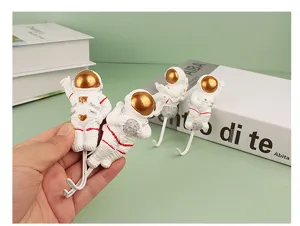 Resin astronaut hook detail, cute decorative wall mount for home, kitchen, and room organization.