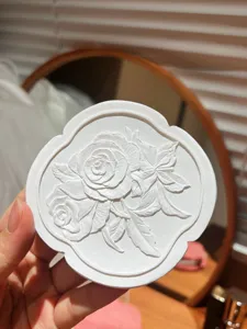 White resin irregular jewelry tray with embossed rose design, perfect photo prop and home decor.