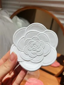 White resin camellia flower jewelry tray aesthetic detail close up photography display