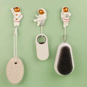 Creative resin astronaut wall hooks punch-free adhesive decorative clothes hangers set for kitchen home.