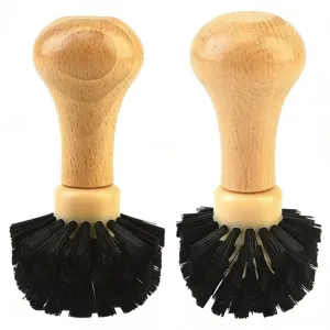 Wooden coffee portafilter cleaning brush with durable black bristles for espresso machine.