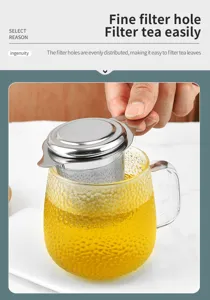 Stainless steel tea infuser detail showing fine filter holes and convenient handle design.
