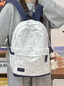 Vintage Schulrucksack mit Sternenmuster dunkelblauen Akzenten und Plüschbär-Anhänger