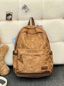 Nahaufnahme eines braunen Vintage-Rucksacks mit Sternenmuster und XinBoKa-Lederpatch-Logo