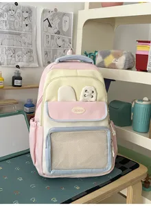 Zaino scolastico rosa e giallo a contrasto con orecchie di coniglio e tasca a rete