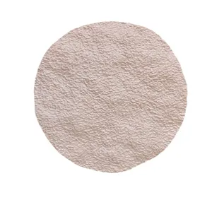Round textured photography prop mat with irregular surface grain, ideal for jewelry displays.