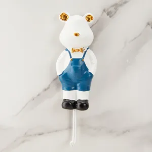 Gancio da parete per orsetto carino creativo, appendiabiti decorativo con bavaglino blu.