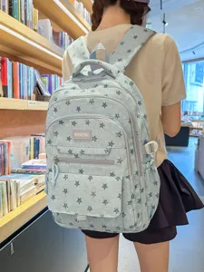 Stylish light blue school backpack featuring a cute dark star pattern for teenage girls