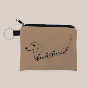 Detailopname van stoffen munttasje met dachshund-print en handige sleutelhanger.