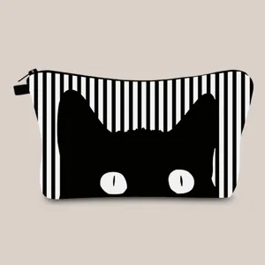 Macro view of the cute black cat silhouette print on the striped fabric cosmetic bag