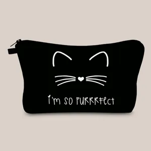 Close-up of black canvas makeup bag with cute white cat print and cat pun text