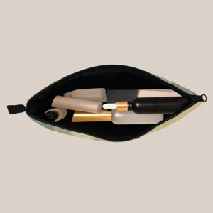 Close-up internal view of a portable cosmetic bag showing capacity for skincare bottles