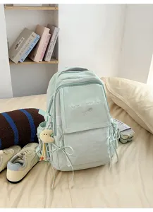 Sac à dos d'école vert menthe avec broderie Have a good day et nœuds latéraux