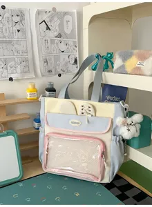 Detailed view of a sweet Japanese style pastel ita-bag with a clear front mesh pocket