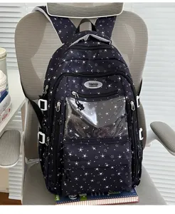 Mignon sac à dos d'école bleu marine avec motifs étoiles et pochette transparente.