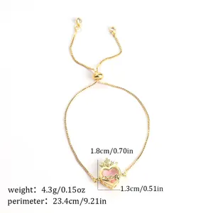 Adjustable gold tone bracelet featuring a pink zircon heart pendant and delicate chain detail.
