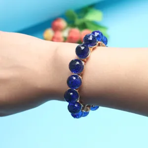 Detailed close-up of the blue faceted crystal bead bracelet, showing the fine texture and design.