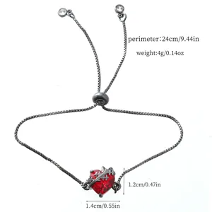 Detailed view of a gothic red zircon heart adjustable slider bracelet with black chain design.