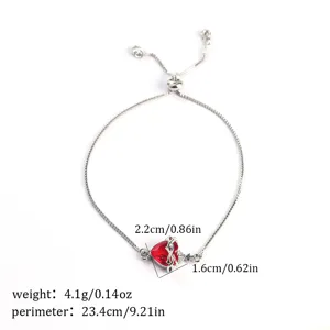 Silver adjustable bracelet featuring a stunning red heart gemstone and intricate crown design.