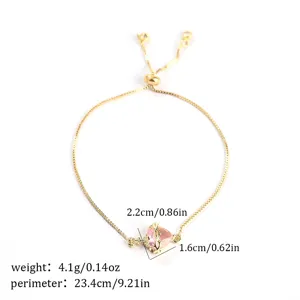 Gold adjustable bracelet with pink heart zircon pendant, featuring detailed crown heart charm.