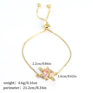 Gold adjustable slider bracelet featuring a pink heart stone pendant with sword design.