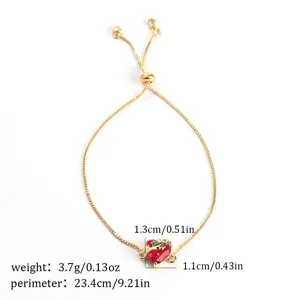 Gold adjustable slider bracelet featuring a stunning red heart zircon pendant for women.
