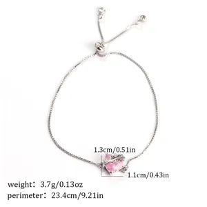 Pink zircon heart bracelet detail view with adjustable silver chain and crystal pendant.