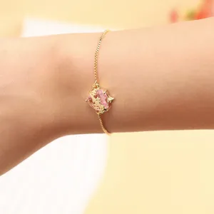 Elegant gold adjustable chain bracelet featuring a sparkling pink heart zircon pendant.