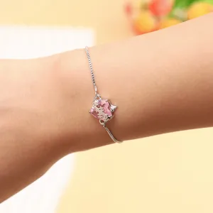 Close-up shot of the delicate pink heart zircon bracelet with adjustable silver chain detail.
