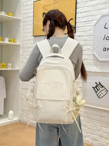 Sac à dos d'étudiant crème minimaliste avec broderie de lettres et grande capacité.