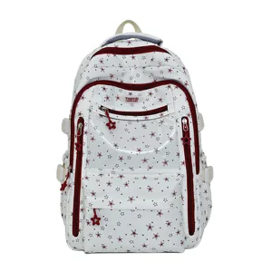 Gros plan d'un sac à dos d'écolier blanc avec motifs d'étoiles rouges et zips étoiles