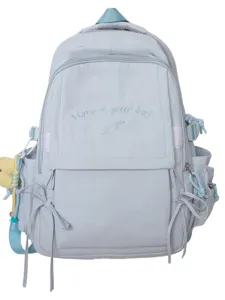 Sac à dos scolaire minimaliste bleu clair avec broderie 'Have a good day' et détails rubans