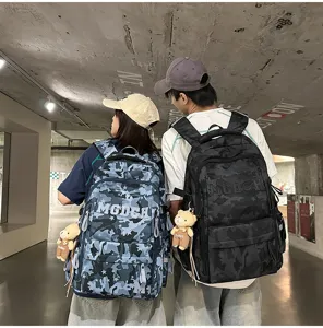 Detail view of trendy large capacity camouflage backpacks in blue and black styles.