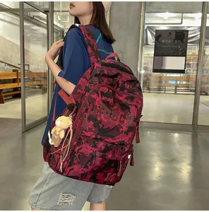 Stylish red camouflage backpack with large capacity for students and street fashion.
