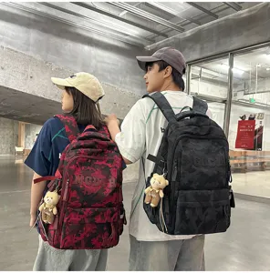 Students wearing stylish camouflage backpacks in a modern school or university setting