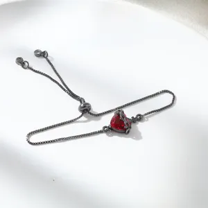 Dark gothic style adjustable box chain bracelet with red crystal heart and small cross charm.