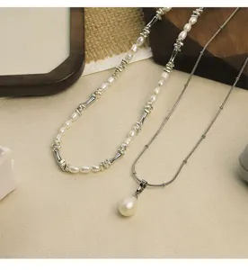 Detailed view of natural freshwater pearl necklace set with bamboo metal accents.
