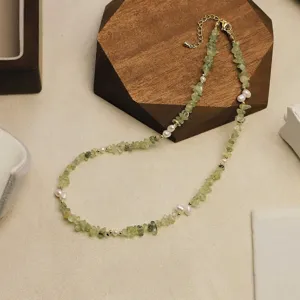 Elegant necklace featuring natural prehnite stone chips and pearls with gold beads accents