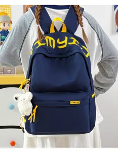Rear view of a navy blue student backpack with yellow embroidery and bear pendant