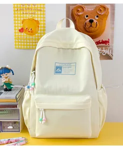 Elegante zaino scolastico giallo crema per ragazze con simpatici tiri zip e patch frontale