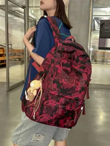 Large-capacity trendy camouflage schoolbag with star patterns and cute teddy bear charm