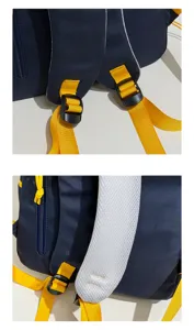 Detailed view of breathable mesh shoulder straps and yellow buckles on navy blue backpack.