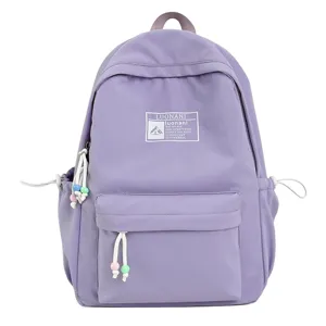 Zaino scolastico viola lavanda con perline decorative e toppa stampata di dettaglio